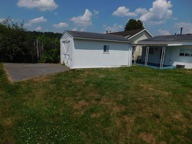 115 Ullom St, Fairmont, WV 26554 - rear view of property with an outbuilding, a shed, a patio, and a lawn