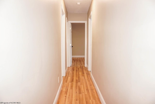 corridor featuring light hardwood / wood-style flooring