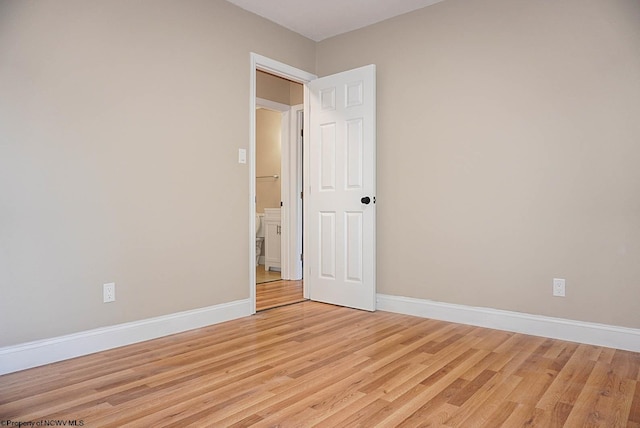 unfurnished bedroom with light wood-type flooring