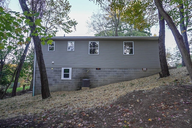 view of side of property with central AC unit