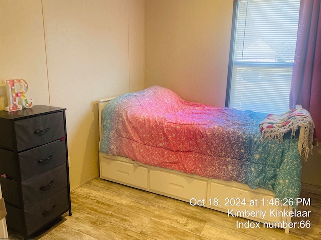 bedroom with light hardwood / wood-style floors