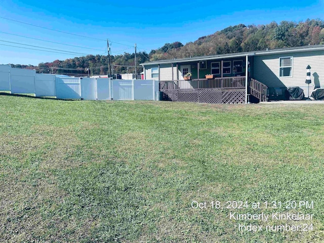 view of yard featuring a deck