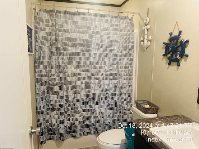 bathroom with vanity, toilet, and walk in shower