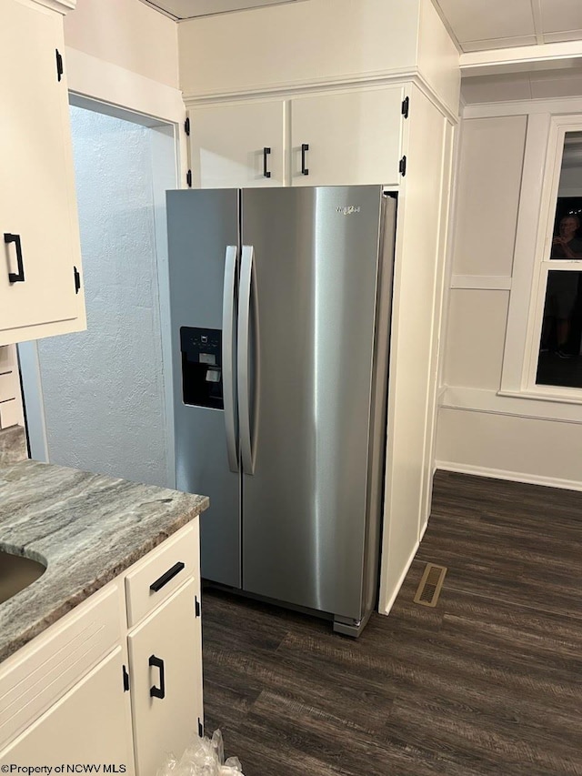 428 James St, Bridgeport, WV 26330 - kitchen with visible vents, stone countertops, dark wood-style floors, stainless steel fridge, and white cabinetry