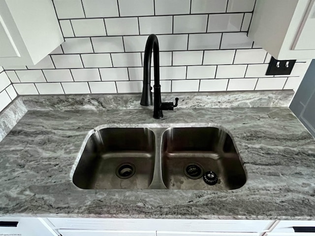 428 James St, Bridgeport, WV 26330 - room details with a sink, decorative backsplash, and light stone countertops