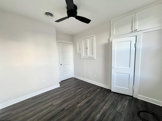 428 James St, Bridgeport, WV 26330 - unfurnished bedroom with ceiling fan, dark wood-style flooring, visible vents, baseboards, and a closet
