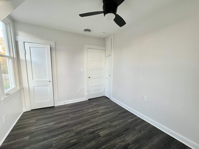 428 James St, Bridgeport, WV 26330 - unfurnished bedroom featuring baseboards, a ceiling fan, dark wood-style flooring, and visible vents