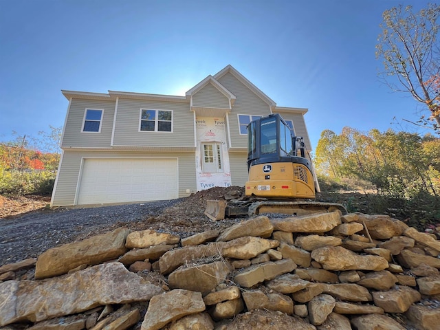 bi-level home featuring driveway and an attached garage