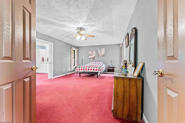 bedroom featuring ceiling fan, carpet flooring, and a textured ceiling