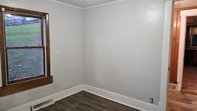 unfurnished room featuring baseboards, visible vents, ornamental molding, and dark wood-type flooring