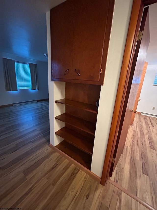 stairs with hardwood / wood-style floors