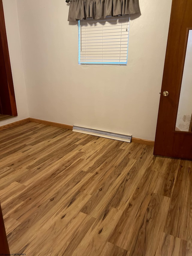 unfurnished room featuring hardwood / wood-style floors