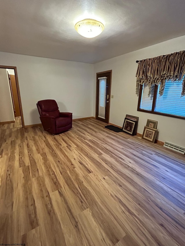 unfurnished room with hardwood / wood-style floors