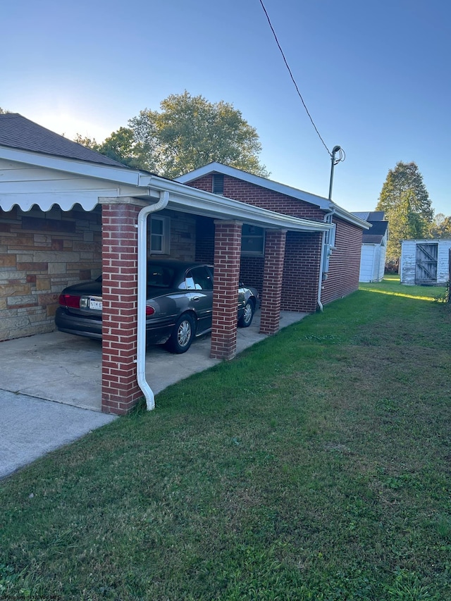 view of side of home with a yard and a carport