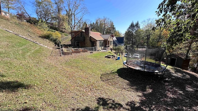 view of yard with a trampoline