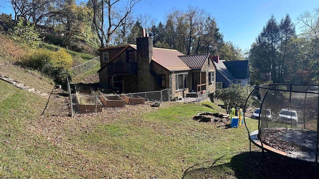 view of yard with a trampoline