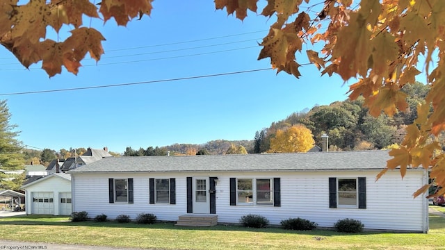 ranch-style house with a front lawn