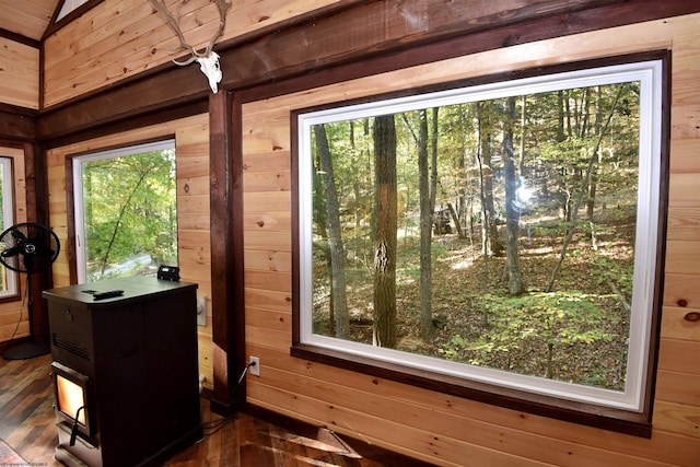 doorway to outside with wooden walls and dark hardwood / wood-style floors