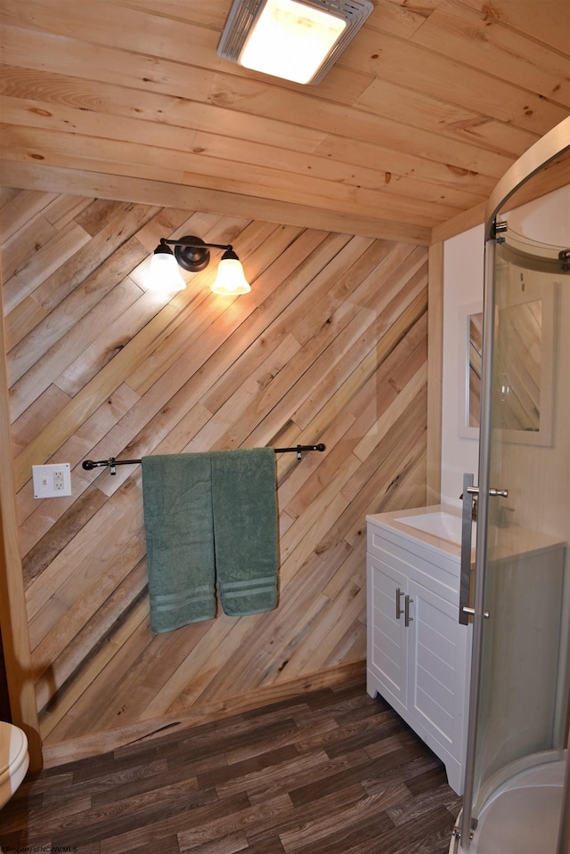 bathroom featuring vanity, wood ceiling, hardwood / wood-style flooring, and wood walls