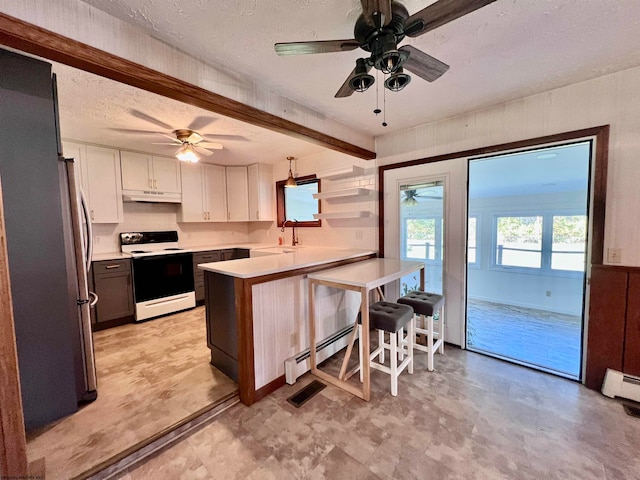 kitchen with sink, kitchen peninsula, white cabinetry, white electric range oven, and a breakfast bar