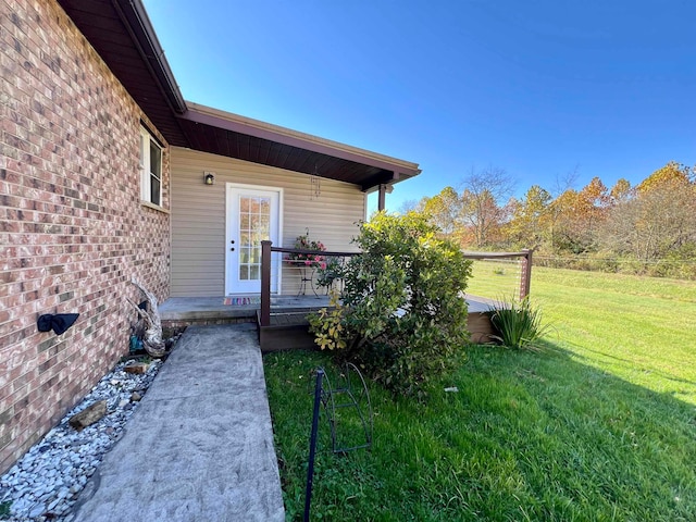 property entrance with a yard