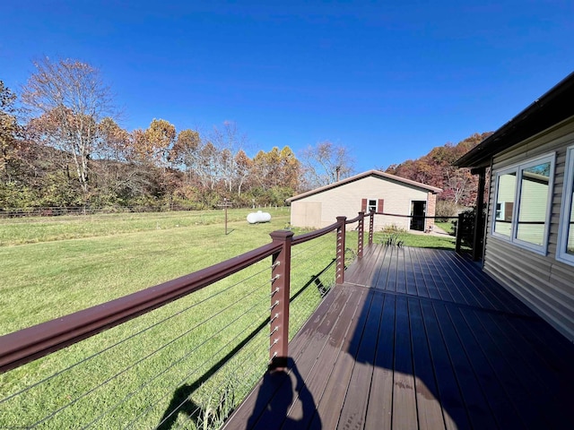 deck with a yard and a storage shed