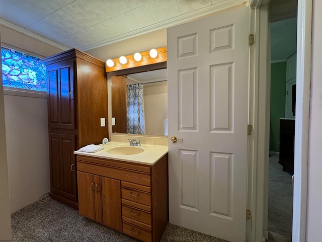 bathroom with vanity and crown molding