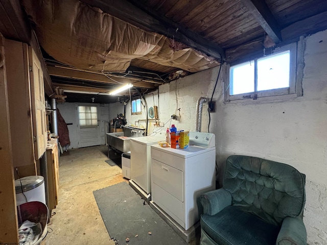 basement with plenty of natural light and washing machine and clothes dryer