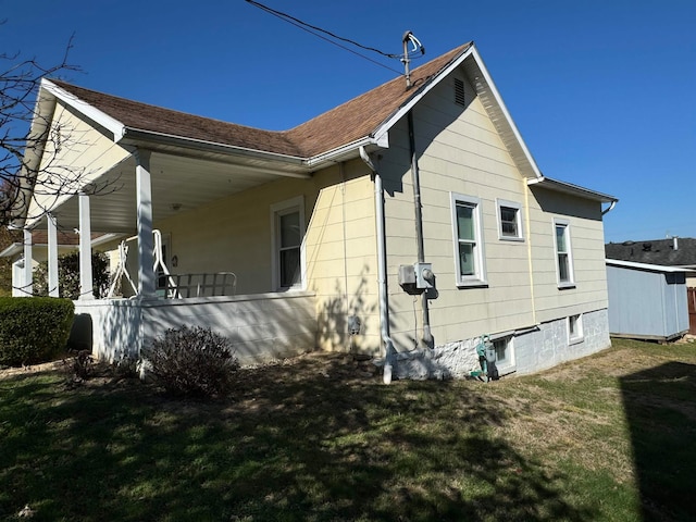 view of home's exterior with a lawn