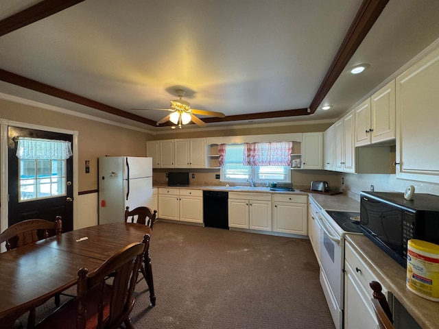 kitchen with black appliances, sink, ceiling fan, dark carpet, and white cabinets