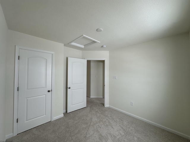 unfurnished bedroom with light carpet