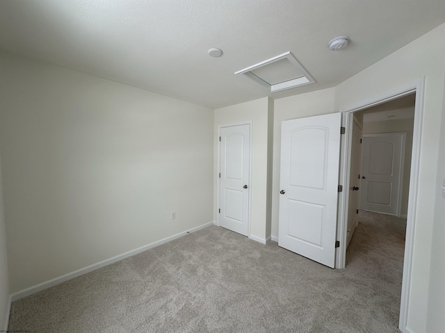 unfurnished bedroom with light carpet