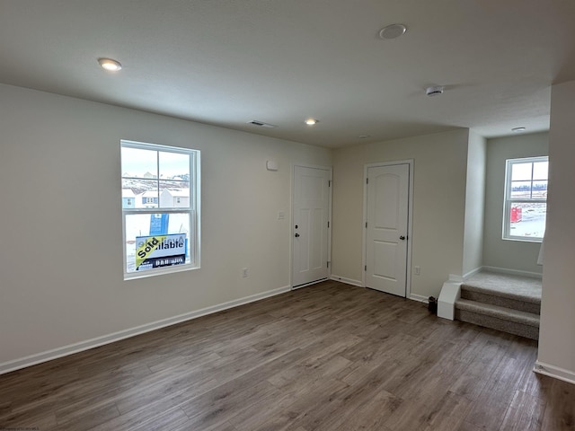 empty room with hardwood / wood-style floors