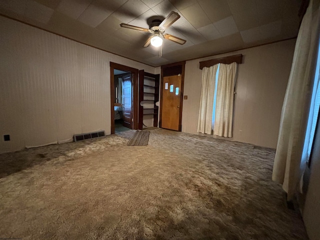 carpeted empty room with ceiling fan