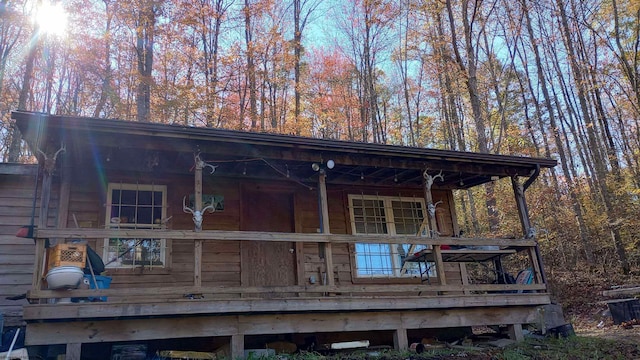 back of house with central AC unit