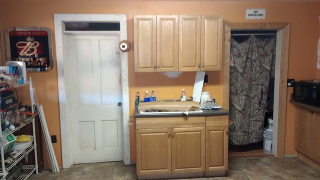 kitchen featuring dark countertops and black microwave