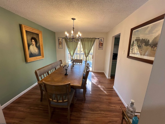 dining room with a notable chandelier, a textured ceiling, and dark hardwood / wood-style flooring