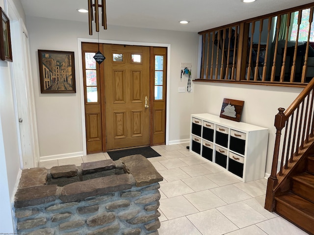 entrance foyer featuring a wealth of natural light and light tile patterned floors