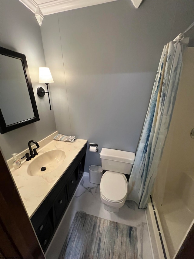 bathroom featuring vanity, curtained shower, ornamental molding, and toilet