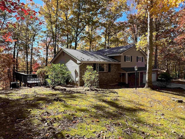 view of side of home featuring a wooden deck