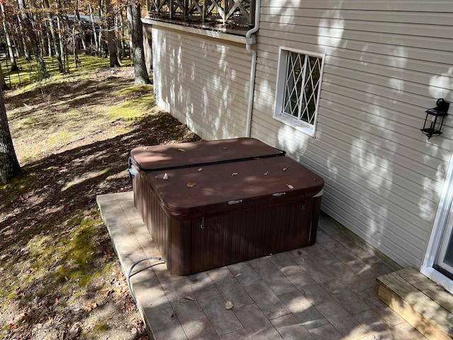 details featuring a hot tub and wooden walls