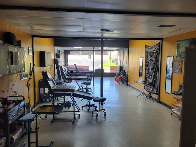 workout area with wooden walls