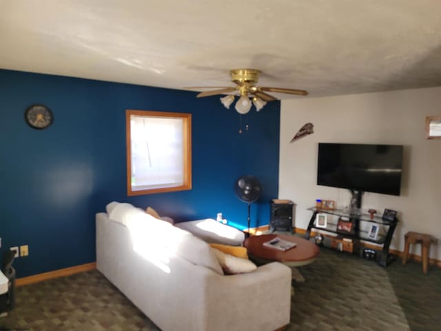 living room featuring ceiling fan