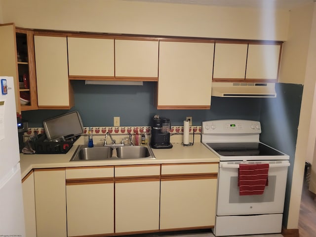 kitchen with white electric range, hardwood / wood-style flooring, extractor fan, and sink