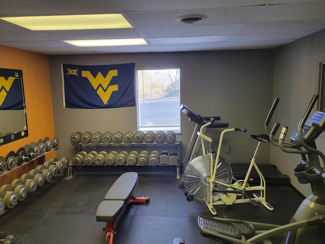 exercise area featuring a drop ceiling