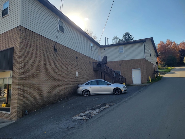 view of side of home featuring a garage