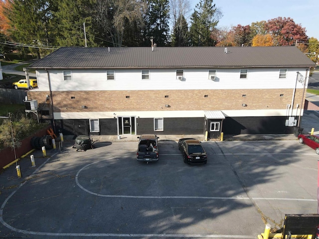 rear view of property featuring cooling unit