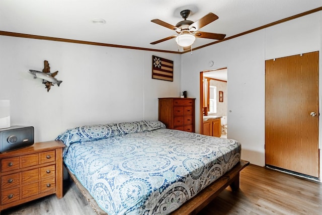 bedroom with ornamental molding, light wood-type flooring, and ceiling fan