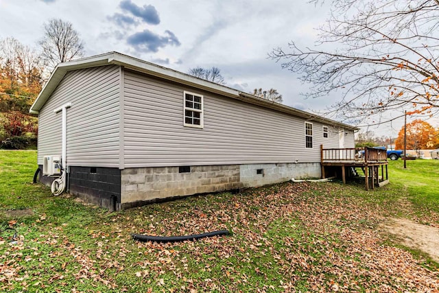 view of property exterior with a wooden deck and crawl space