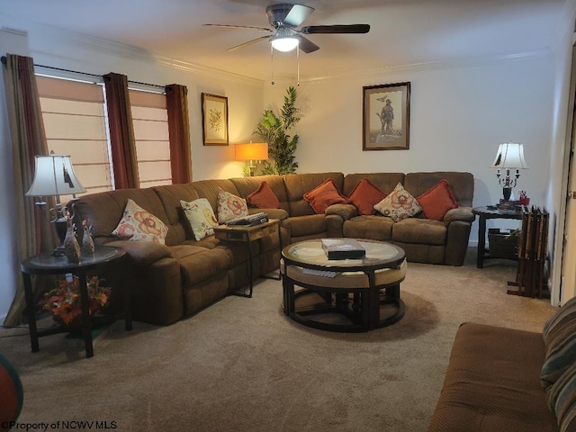 living room with crown molding, light carpet, and ceiling fan